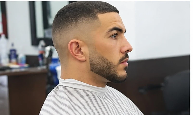 Mid drop fade with buzzed top, low-maintenance style