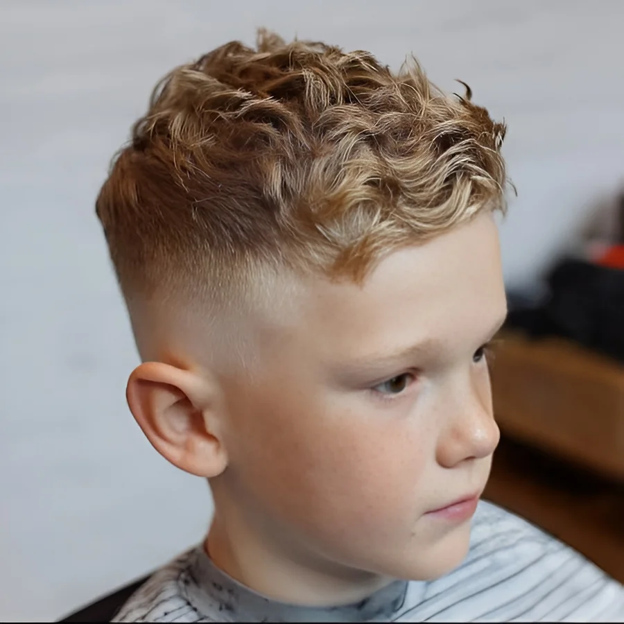 Mid drop fade kids haircut with curly top